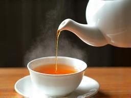 Elegant teapot pouring tea into a cup